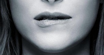 Anastasia Steele bites her lip on new poster for “Fifty Shades of Grey”