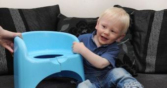 Layton Kennington  put his head through the hole of his plastic seat and became wedged in there