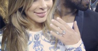 Kim Kardashian is engaged to Kanye West, shows off her massive diamond ring