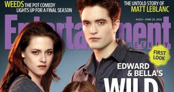 Bella and Edward protect their daughter Renesmee in new “Breaking Dawn Part 2” pic