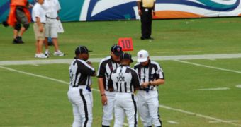 Referees talking to each other, during a football game