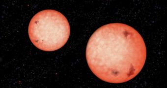Rendition of two red dwarfs orbiting very close to each other