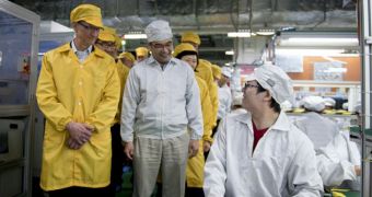 Tim Cook, Apple CEO, on a tour of Foxconn's production lines