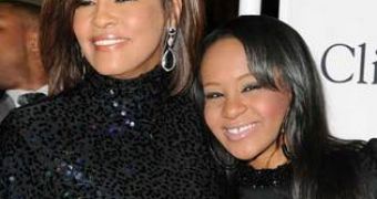 Bobbi Kristina is now dating her “brother,” a boy Whitney Houston “unofficially adopted” 10 years ago