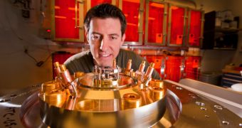 Sandia researcher Ryan McBride pays close attention to the tiny central beryllium liner to be imploded by the powerful magnetic field generated by Sandia’s Z machine