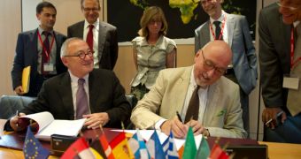 DG Enterprise and Industry director general Heinz Zourek and ESA director general Jean-Jacques Dordain sign the new document, during a June 15 ceremony that took place in Paris, France