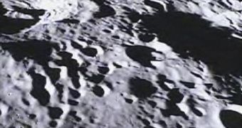 This image of the far side of the lunar surface, with Earth in the background, was taken by the MoonKAM system onboard the Ebb spacecraft