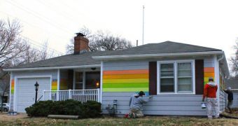A gay pride symbol is being painted in front of a Westboro Baptist church in Topeka