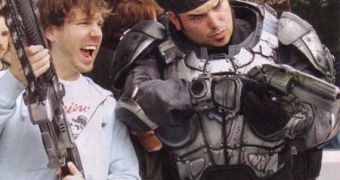 Cliff Bleszinski and his bald space marine from Gears of War