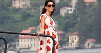 Amal Alamuddin is showing a bit of baby bump in Italy