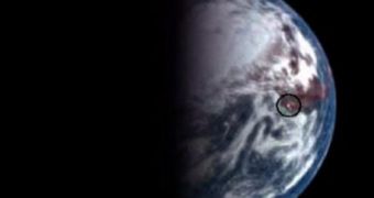 Deep Impact image showing a focused glint (middle of black circle) on the surface of Earth