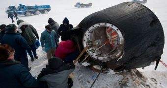 Emergency responders scramble to take the three members of the Soyuz TMA-01M crew out of their space capsule, upon return to Earth in March 2011