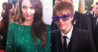 Angelina Jolie and Justin Bieber on the red carpet at the Golden Globes 2011