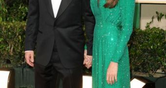 Angelina Jolie and Brad Pitt walk the red carpet at the 2011 Golden Globe Awards