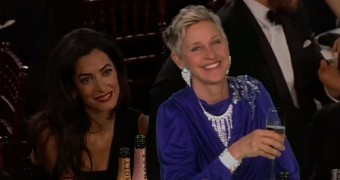Amal Clooney and Ellen DeGeneres listen to George Clooney's speech at the Golden Globes 2015