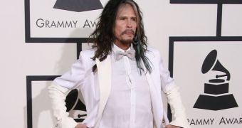 Steven Tyler poses for the cameras on the red carpet at the Grammys 2014