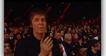 Sir Paul McCartney dances to ELO before noticing a camera is focused on him