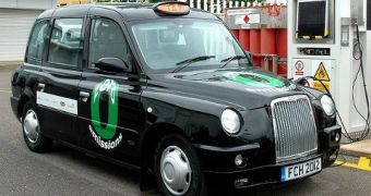 Green Olympic Taxis Taken to Refueling Station by Diesel Trucks