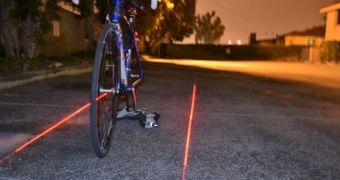 Device uses laser light to "build" bike lanes for cyclists