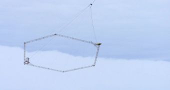 Close up view of helicopter deploying NSF-funded technology to map topography in Antarctica for better research capabilities by scientists