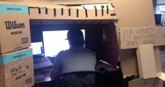 Grown-Up Man Uses Boxes to Turn His Desk into a Fort