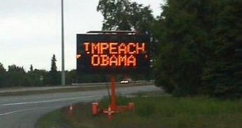 Road signs display "Impeach Obama"