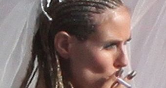 Heidi Klum, the white trash bride, completes the tacky picture with a fake cigarette