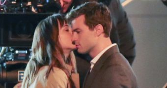 Anastasia Steele and Christian Grey share a moment in “Fifty Shades of Grey” movie