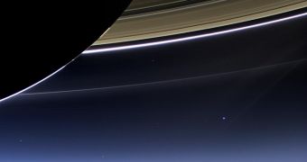 Earth seen from Saturn. Our planet is the blue-ish dot to the center-right of the image