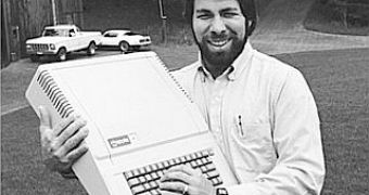 Young Woz holding an Apple II