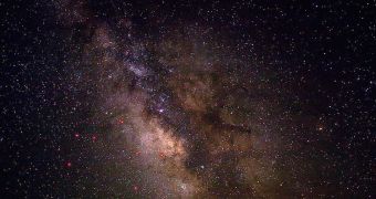 A dark satellite may orbit the Milky Way some 300,000 light-years away from the galactic core (pictured)