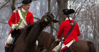 A horse shows its excitement as it prepares to take part in the reenactment of the Revolutionary War