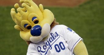 Kansas City Royals mascot Slugger throwing hot dogs wrapped in tinfoil in the stands