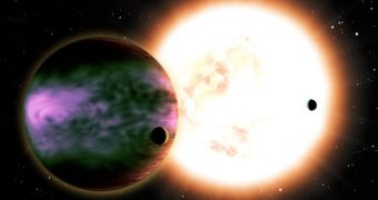 This artist's conception shows a hot Jupiter and its two moons with a Sun-like star in the background. The planet is covered in auroras