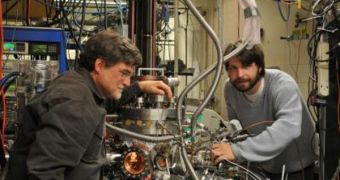University of Utah Chemistry Professor Scott Anderson and doctoral student Bill Kaden work on the elaborate apparatus they use to produce and study catalysts