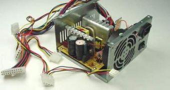 Image of a typical power supply, shown open here in order to display its basic components