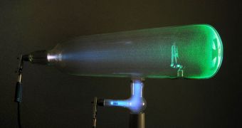 Experiments with a Crookes tube first demonstrated the particle nature of electrons