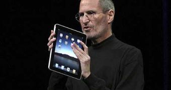 Steve Jobs showing the first iPad to the world