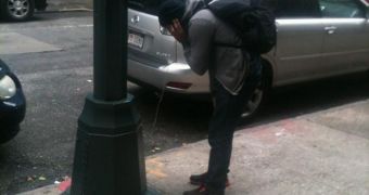 Man charges his phone at a lamppost after Sandy hit NYC