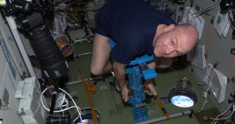 Astronaut André Kuipers getting weighed aboard the ISS