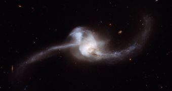 A photo of NGC 2623, showing its peculiar shape, and merged galactic nuclei