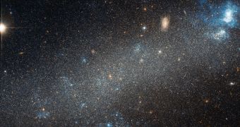 Hubble image showing the dwarf galaxy NGC 2366 and a stellar nursery it contains