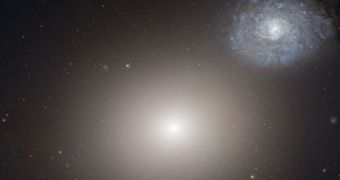 Hubble image showing Messier 60 (foreground) and NGC 4647