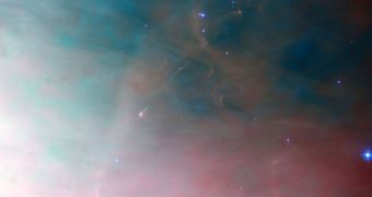 Hubble was able to peer deep into the Orion Nebula, snapping this photo of newly-formed blue stars
