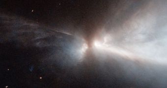Hubble image of a protostar in the Chameleon I gas cloud, creating a Herig-Haro object called HH 909A