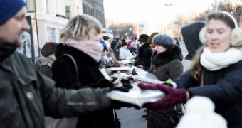Latvians passing books from one another in huge national celebration