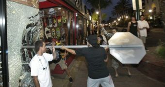 A riot breaks out in Huntington Beach