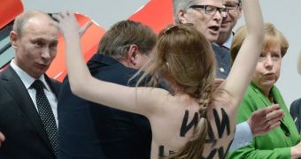 “I Liked It,” Putin Comments on Topless Protest Against Dictatorship