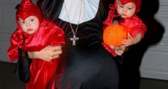 Nadya Suleman, dressed as a pregnant nun, takes octuplets out for trick-or-treating on Halloween