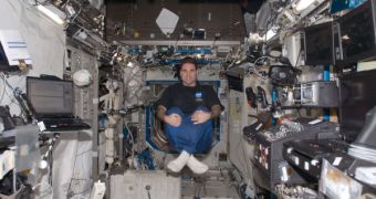 NASA astronaut Greg Chamitoff, Expedition 17 flight engineer, poses for a photo while floating in the Destiny laboratory of the International Space Station